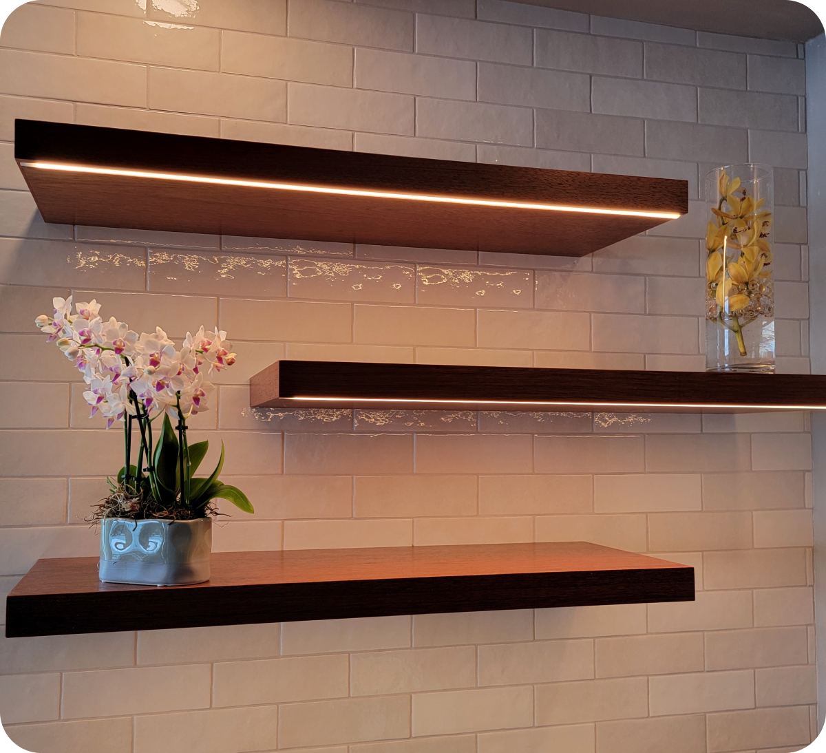 Wall shelves with orchids and vase decor.